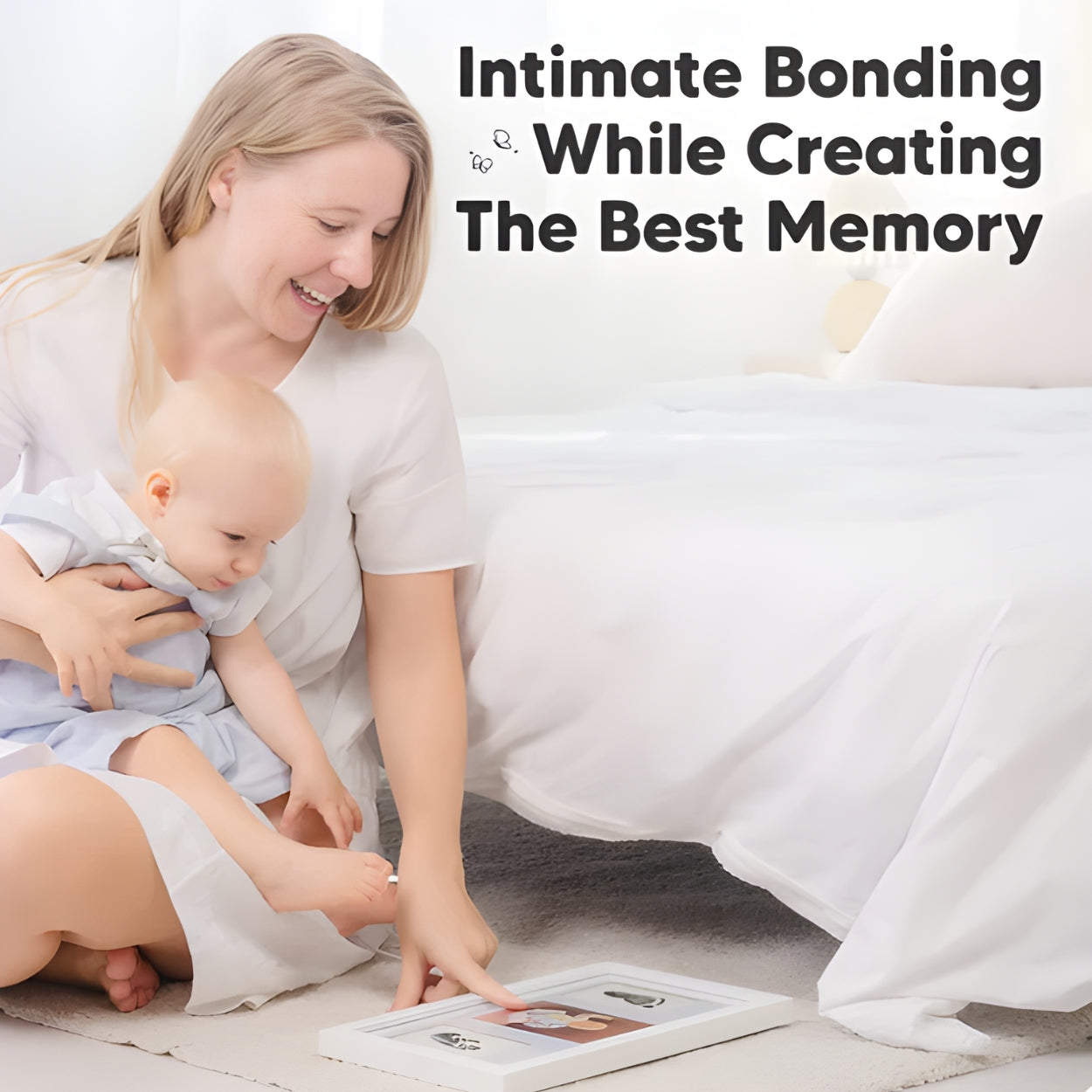 Woman holding a baby and looking at a photo frame with hand and footprints on a bed, with text 'Intimate Bonding While Creating the Best Memory' - Little Treasures